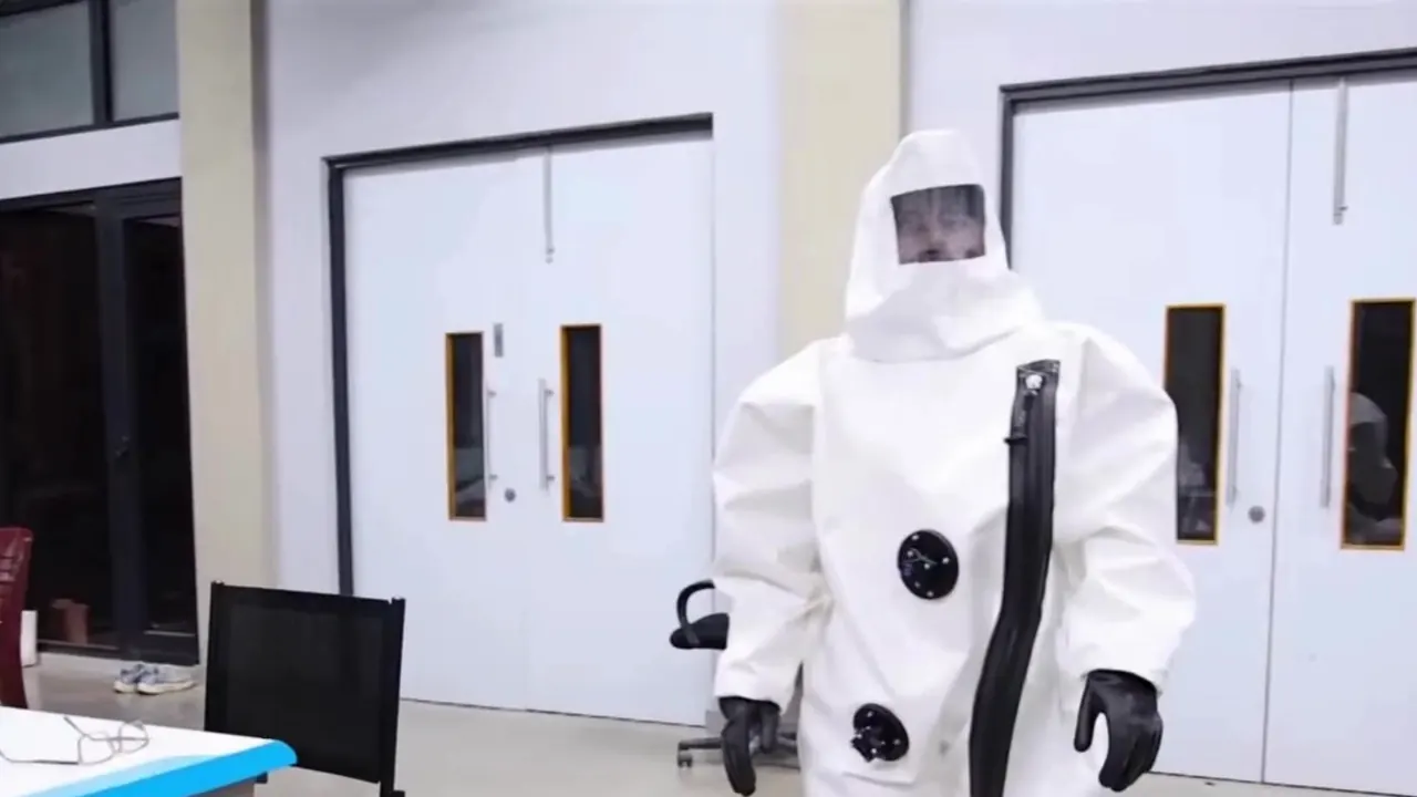 A person wearing the P Suits prototype walking in the lab